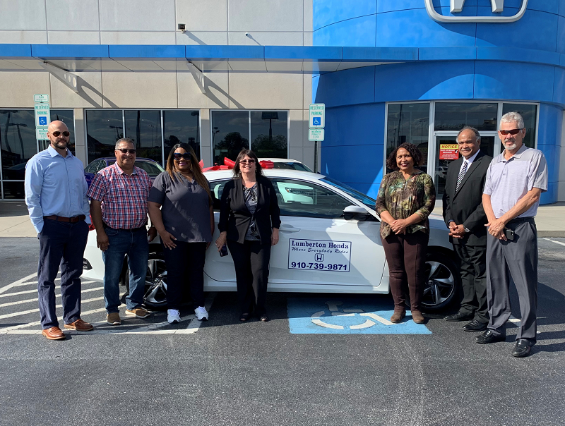 Robeson County high school administrators with the 2020 Honda Civic LX awarded at the 2021 Driven 2 Excel event at Lumberton Honda.